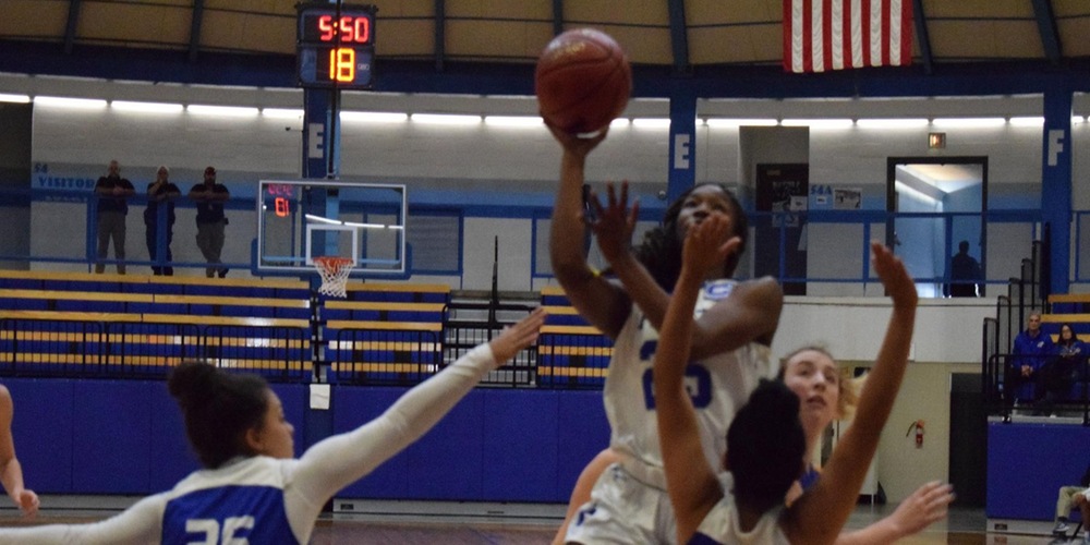 Courtney Cleveland takes a layup against the Tabor defense.